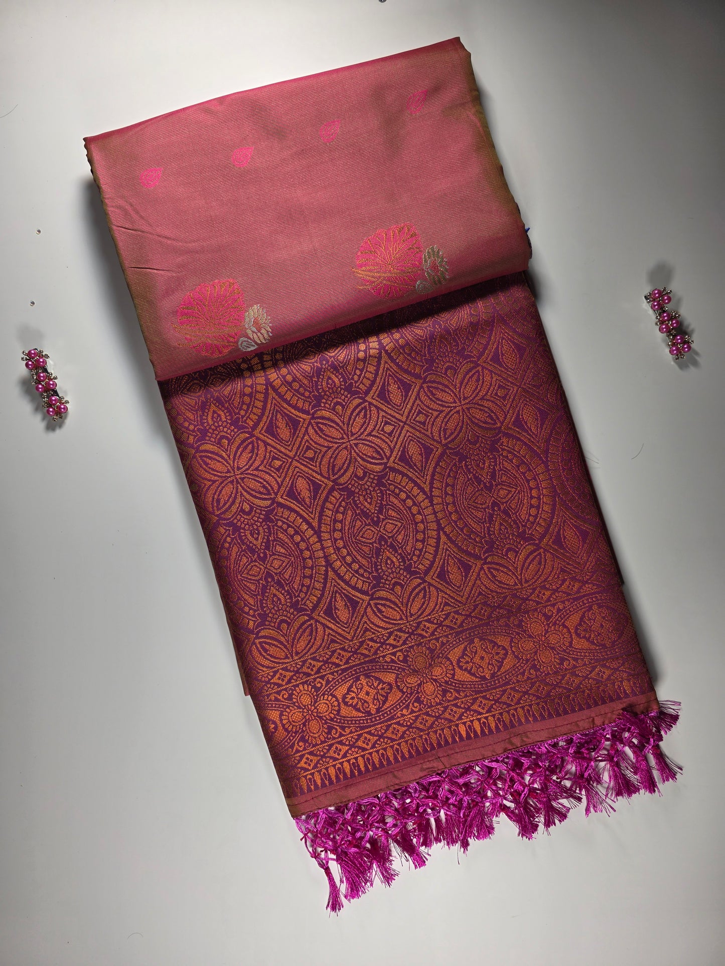 orange silk saree with royal pink border.