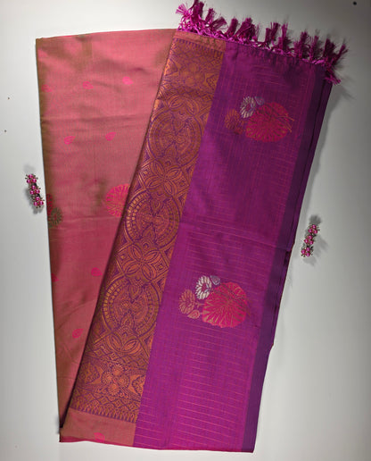 orange  silk  saree with royal pink border.