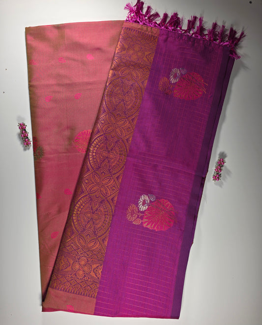 orange  silk  saree with royal pink border.