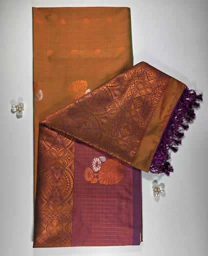 Mustard yellow saree with royal purple border.