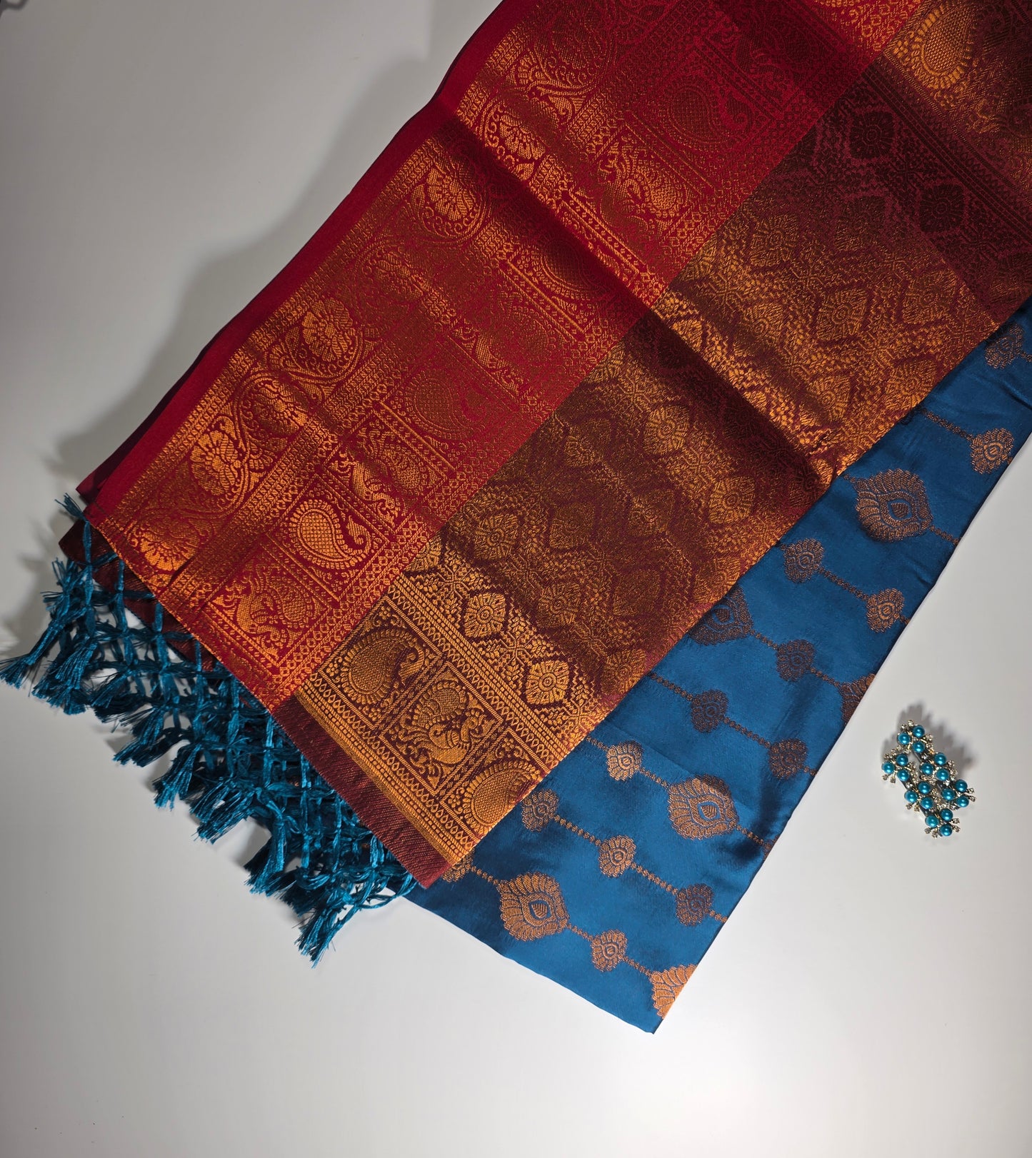 Exquisite Dakshini Pattu Saree: Vibrant Peacock Blue Body with Ornate Maroon Border and Gold Zari Weave