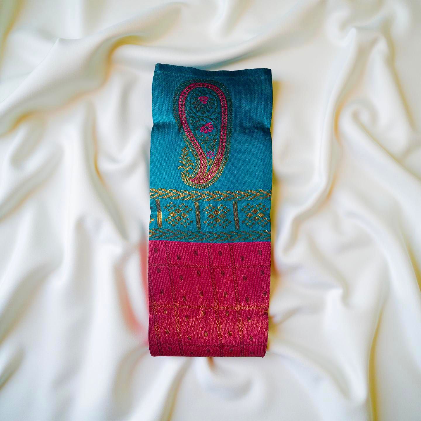 "Charming Kuberapattu: Pink Body with Teal and Paisley Zari Accents"